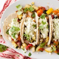 Summer Vegetarian Tacos with Avocado Cream and Feta | http://naturallyella.com
