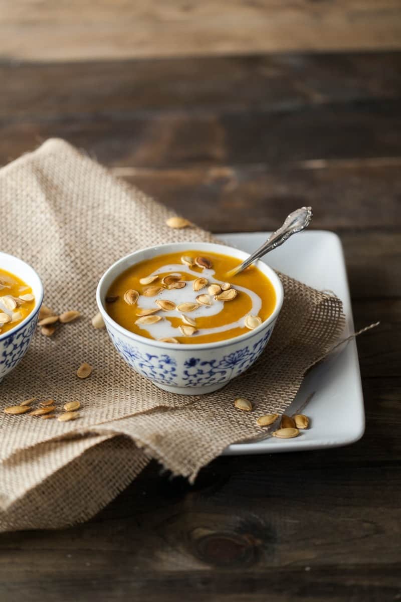 Curried Pumpkin Soup with Coconut and Pumpkin Seeds | http://naturallyella.com