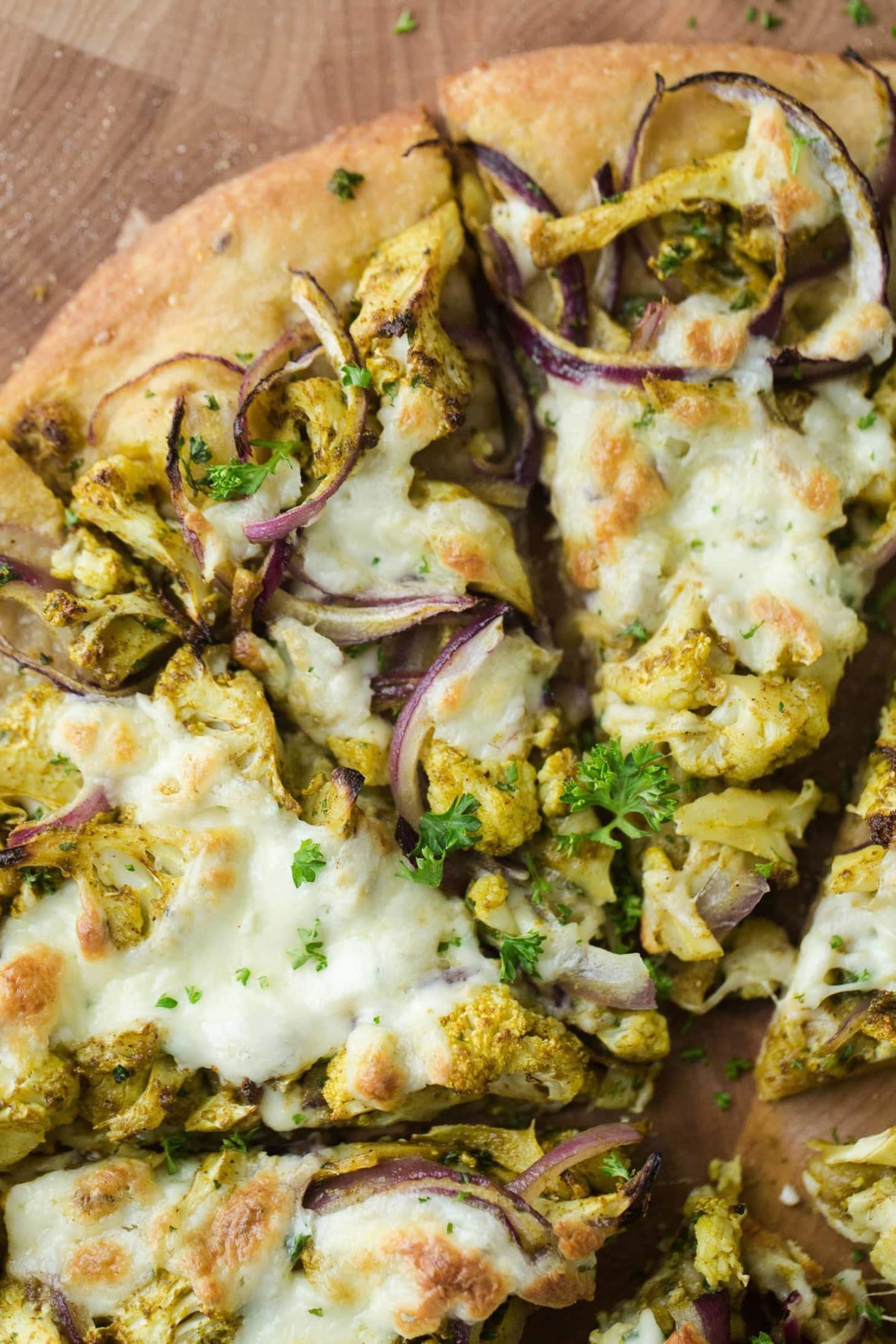 Overhead shot Pizza with Curry Roasted Cauliflower