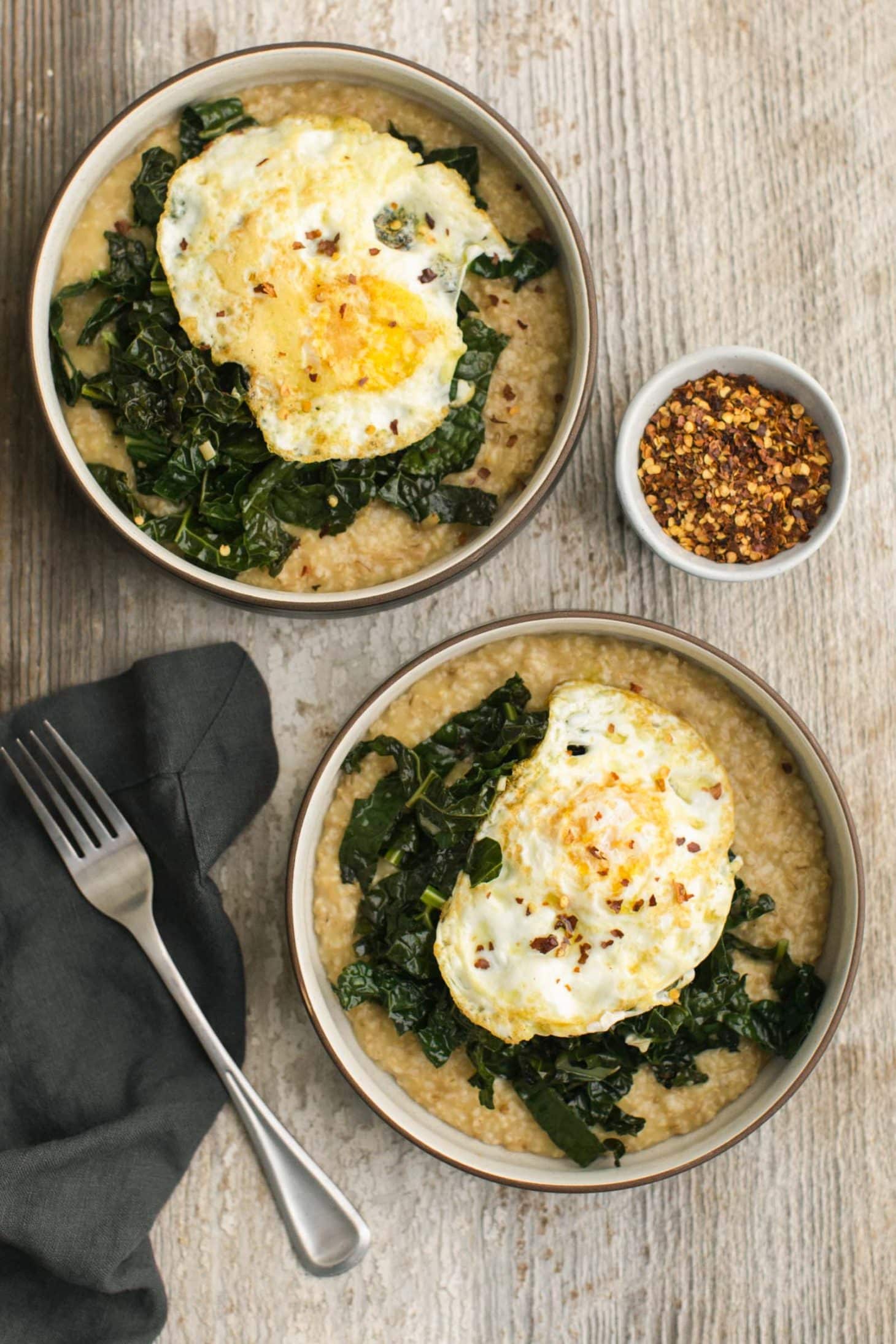 Savory Oatmeal with Garlicky Kale with Fried Eggs | @naturallylella