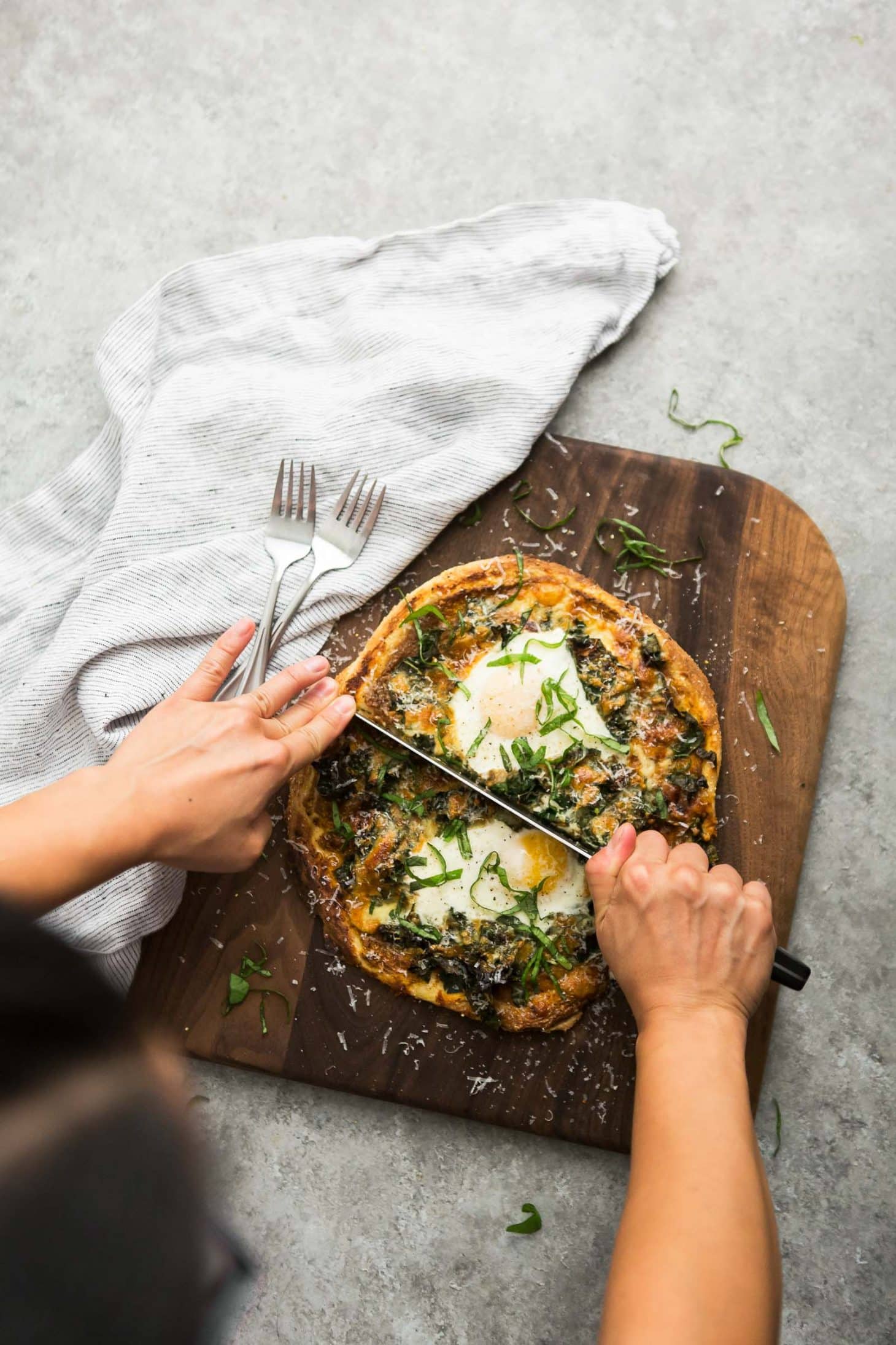 Garlicky Kale Pizza with Homemade Tomato Sauce and Eggs | @naturallyella