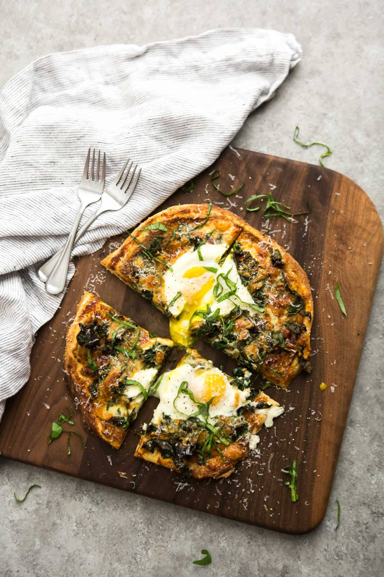 Garlicky Kale Pizza with Eggs and Homemade Tomato Sauce | @naturallyella
