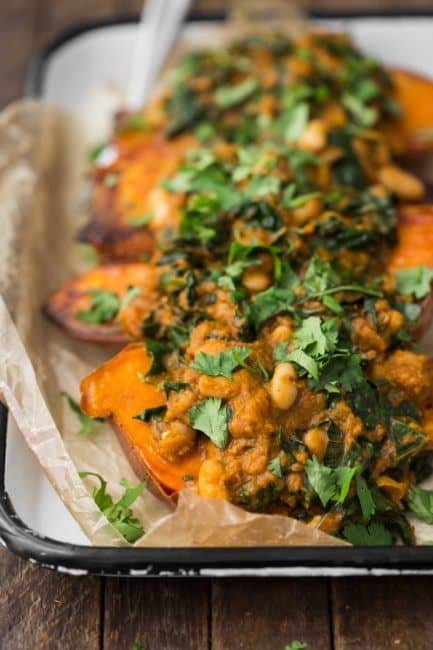 White Bean Masala Smothered Sweet Potatoes with Cilantro | @naturallyella