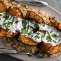 Harissa Acorn Squash with Bulgur and Yogurt Sauce | Naturally Ella