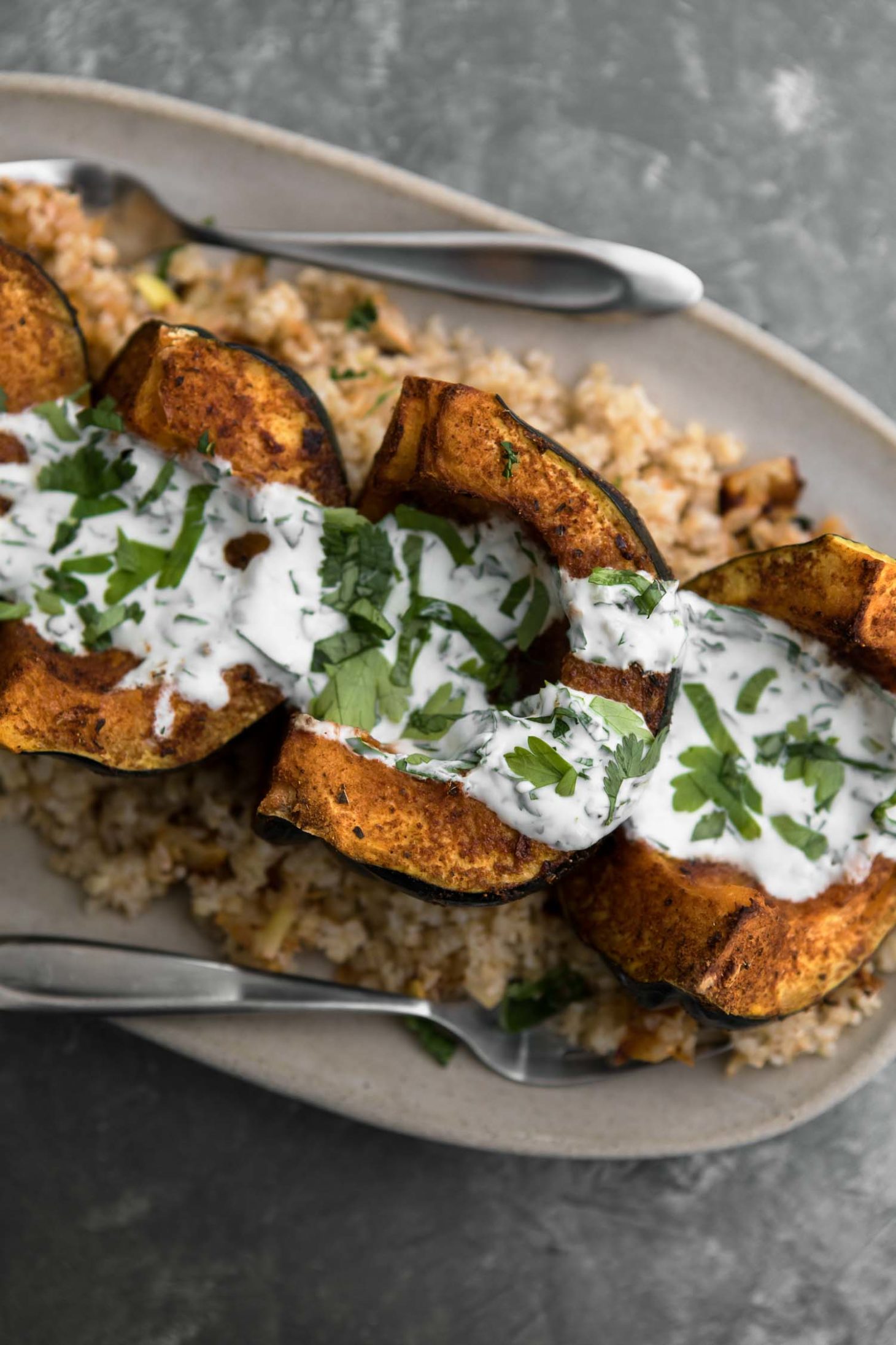 Harissa Acorn Squash with Bulgur and Yogurt Sauce