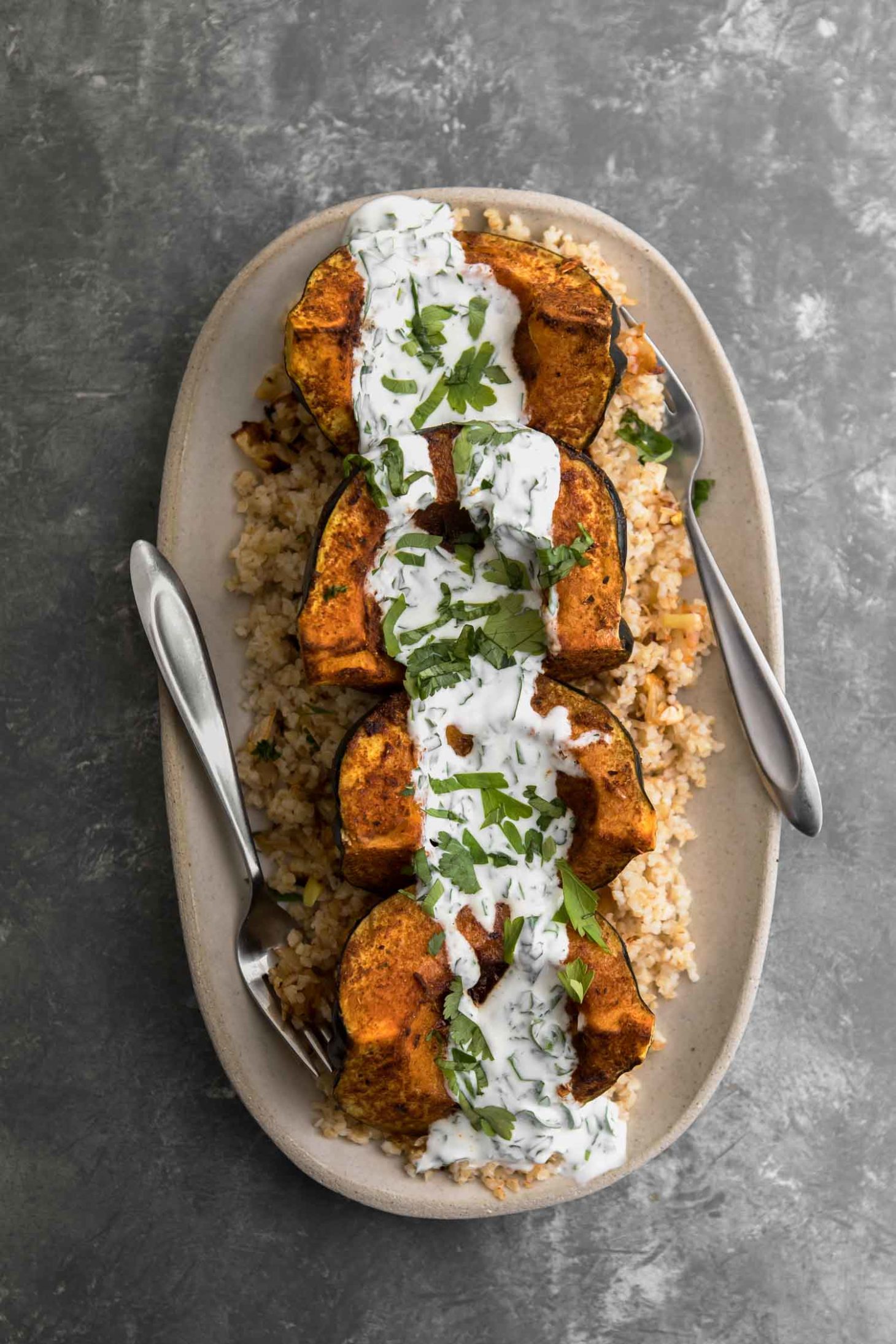 Harissa Acorn Squash with Bulgur and Herbed-Yogurt Sauce | Naturally Ella