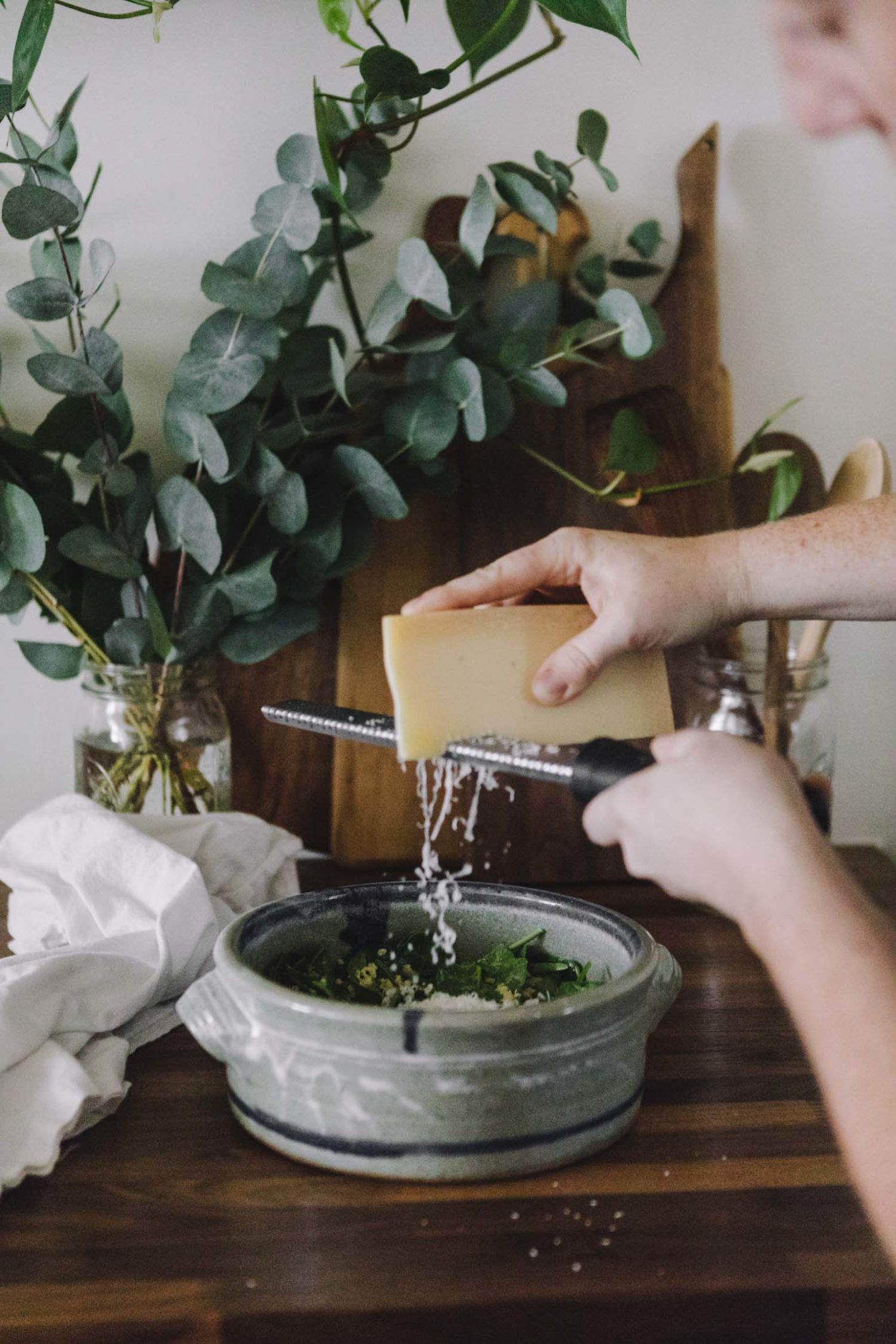 Sideview of Microplane Zester grating parmesan cheese