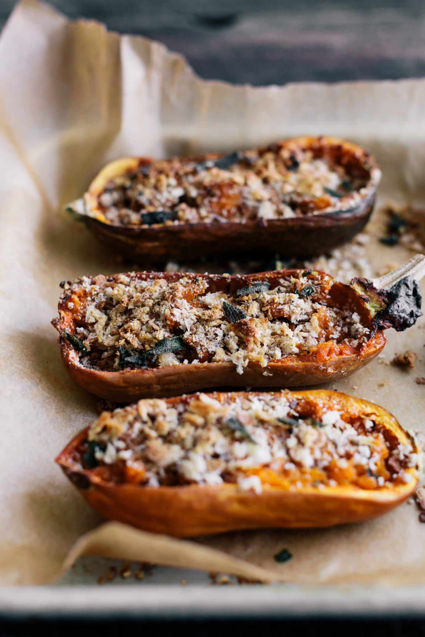 Side shot photo of twice-baked honeynut squash with breadcrumbs and brown butter