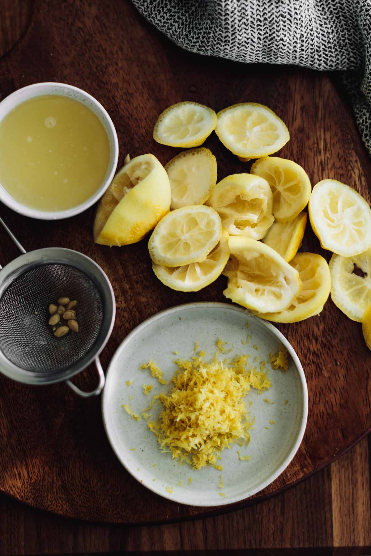 Overhead shot of lemons that have been zest and juiced.