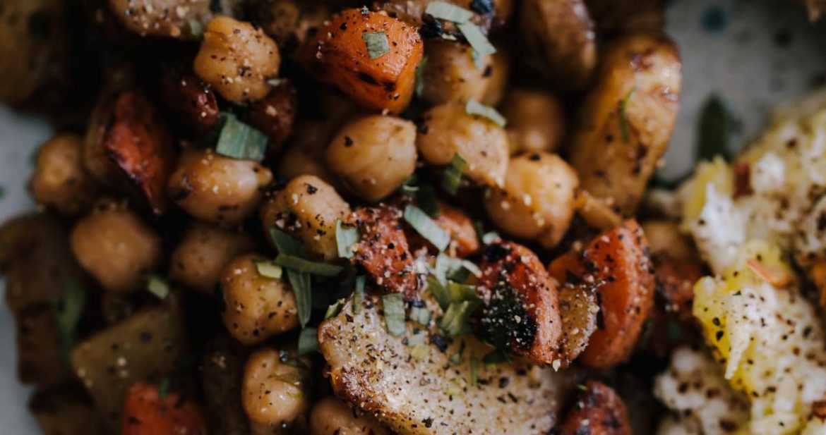 Close-up photograph of sunchoke hash with chickpeas and tarragon.
