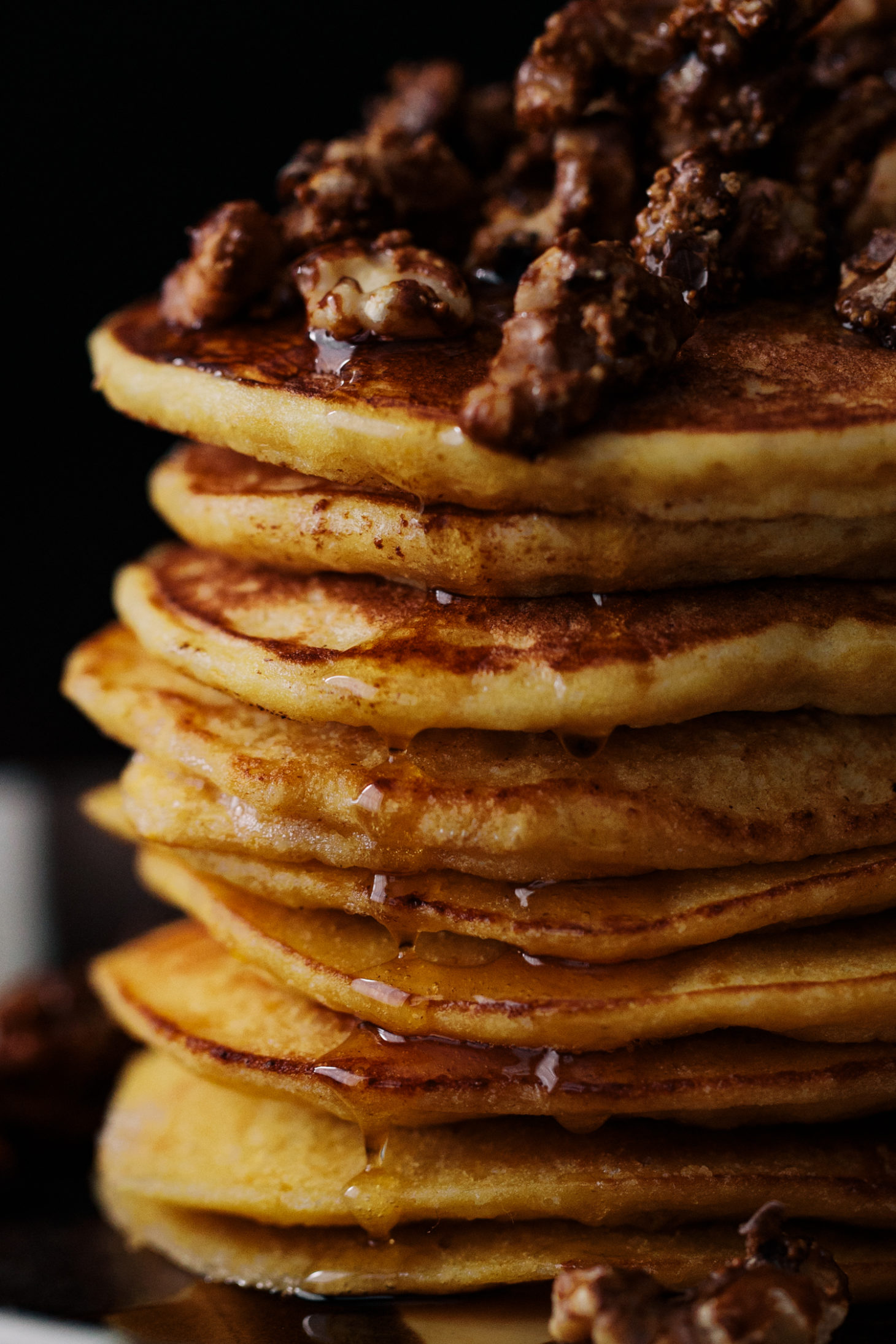 Close-up photograph of a stack of ricotta pancakes made with einkorn flour and kabocha squash puree.