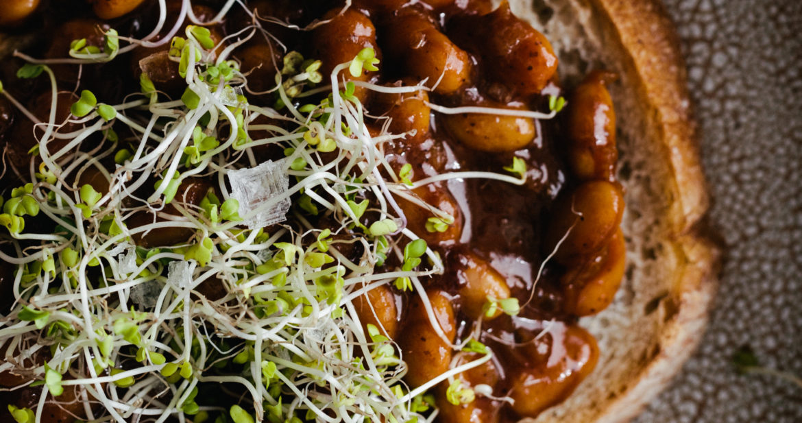 Photograph of Vegan Baked Beans on Toast, topped with microgreens