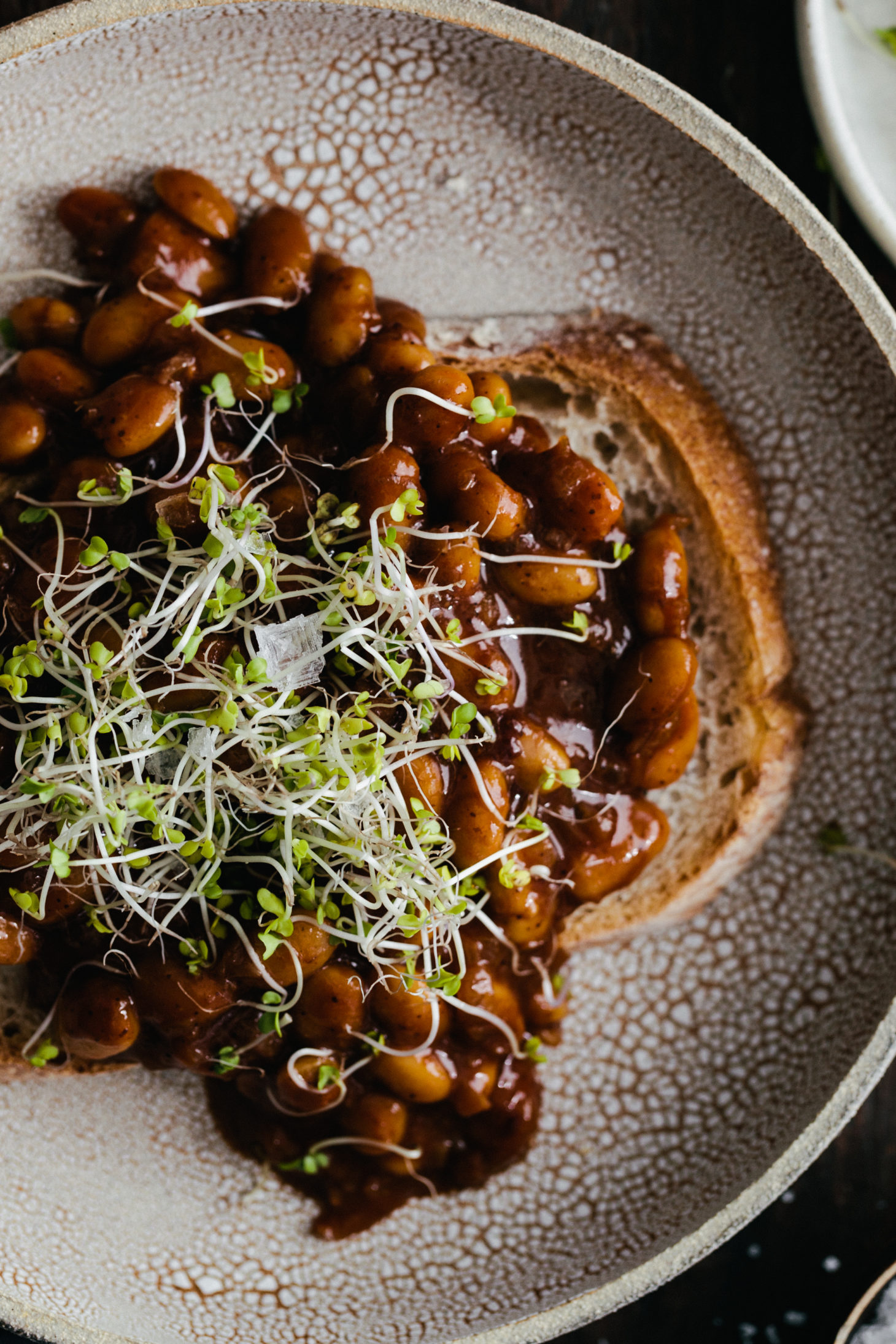 Photograph of Vegan Baked Beans on Toast, topped with microgreens