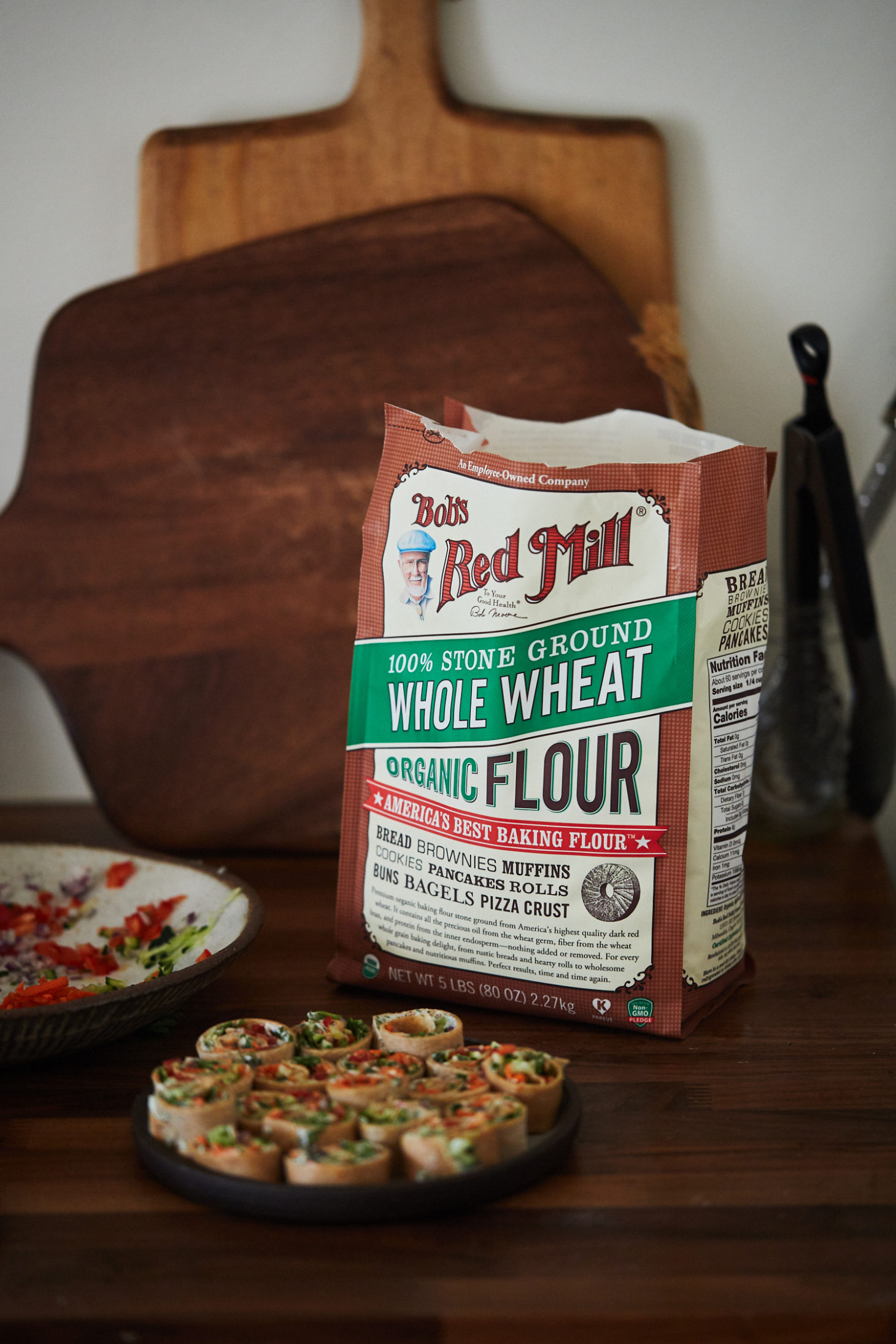 A straight-on photograph of a bag of bob's red mill whole wheat flour.