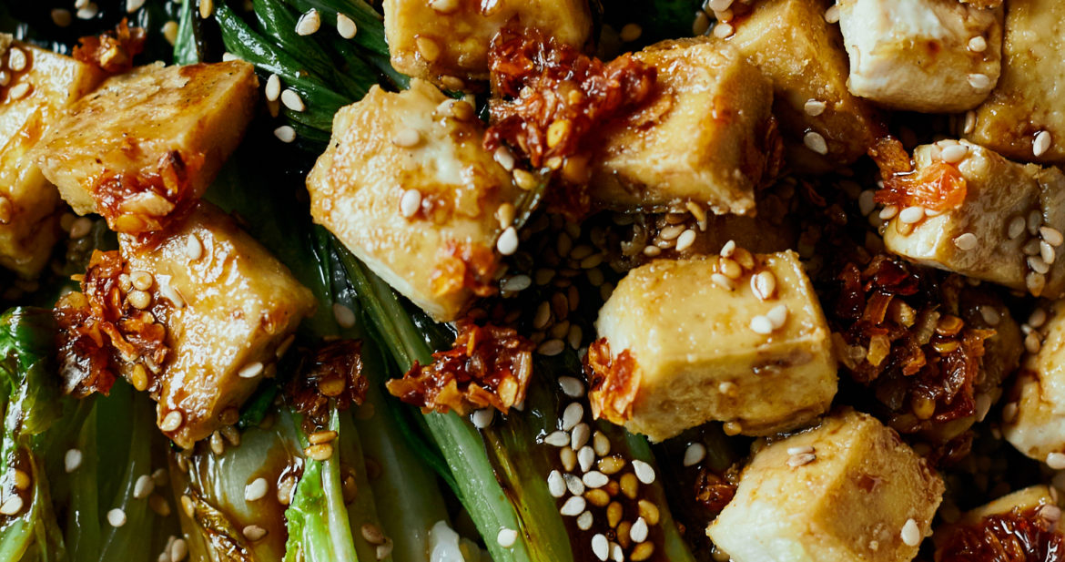 close-up photography of crispy tofu on top of seared bok choy halves and rice