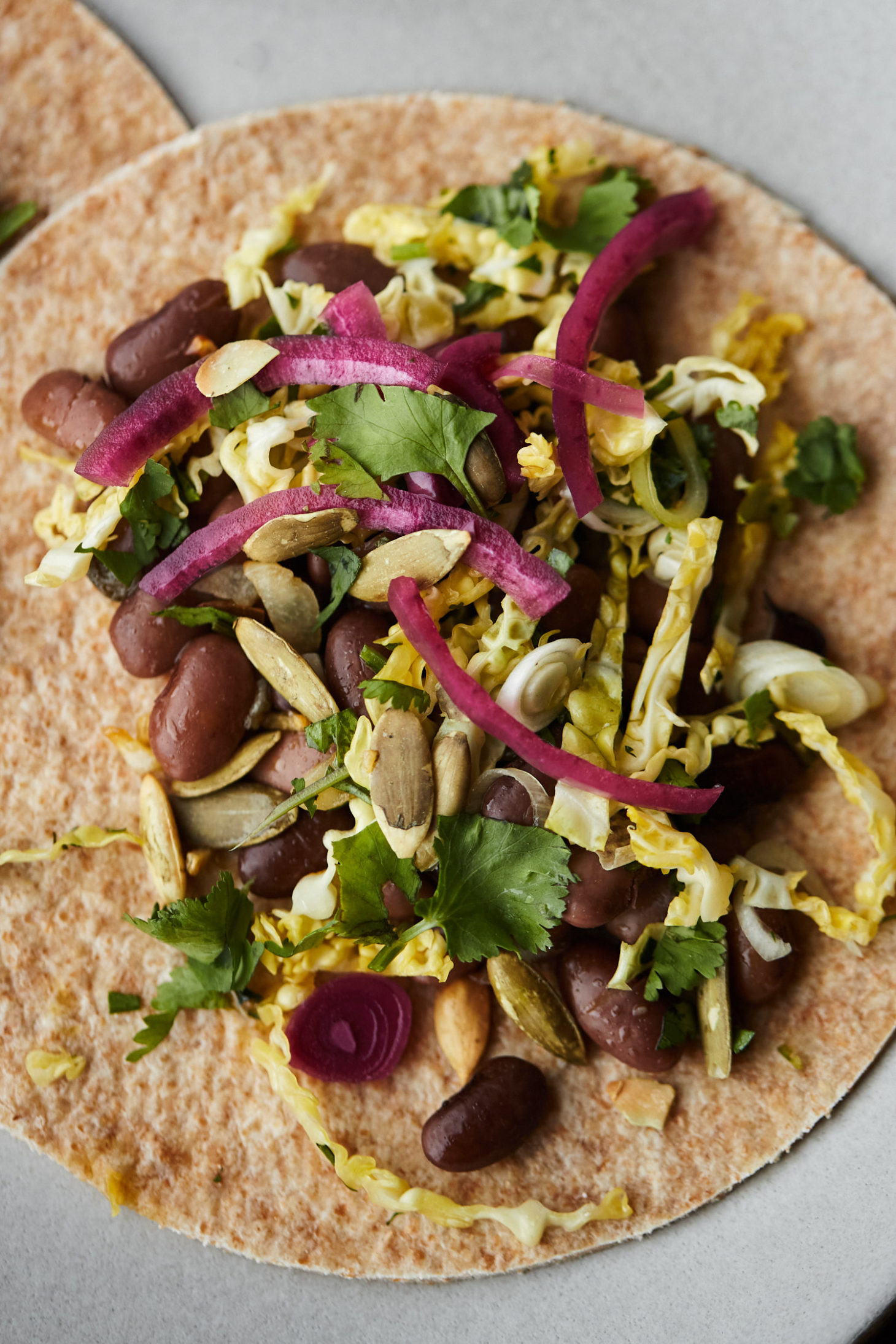Bean and Cabbage Tacos with Pickled Onions