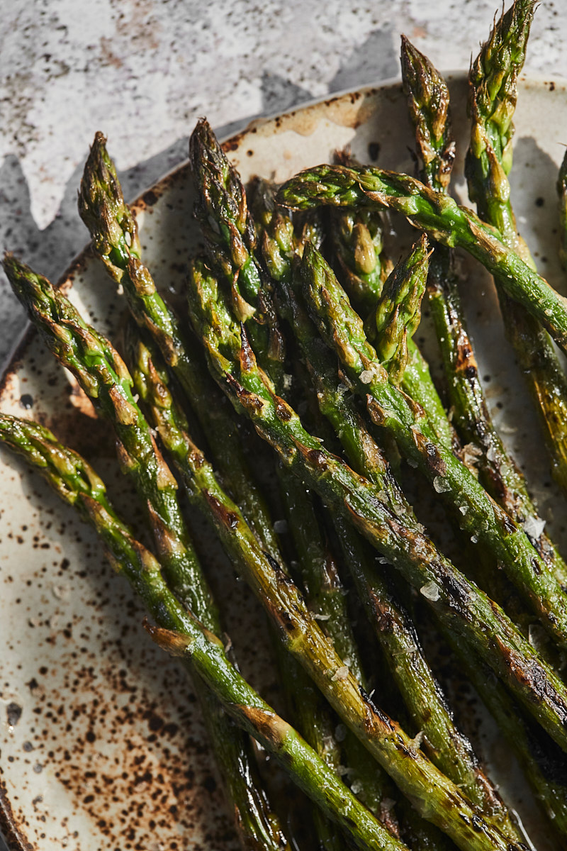 Grilling vegetables with an example of close-up of grilled asparagus. 