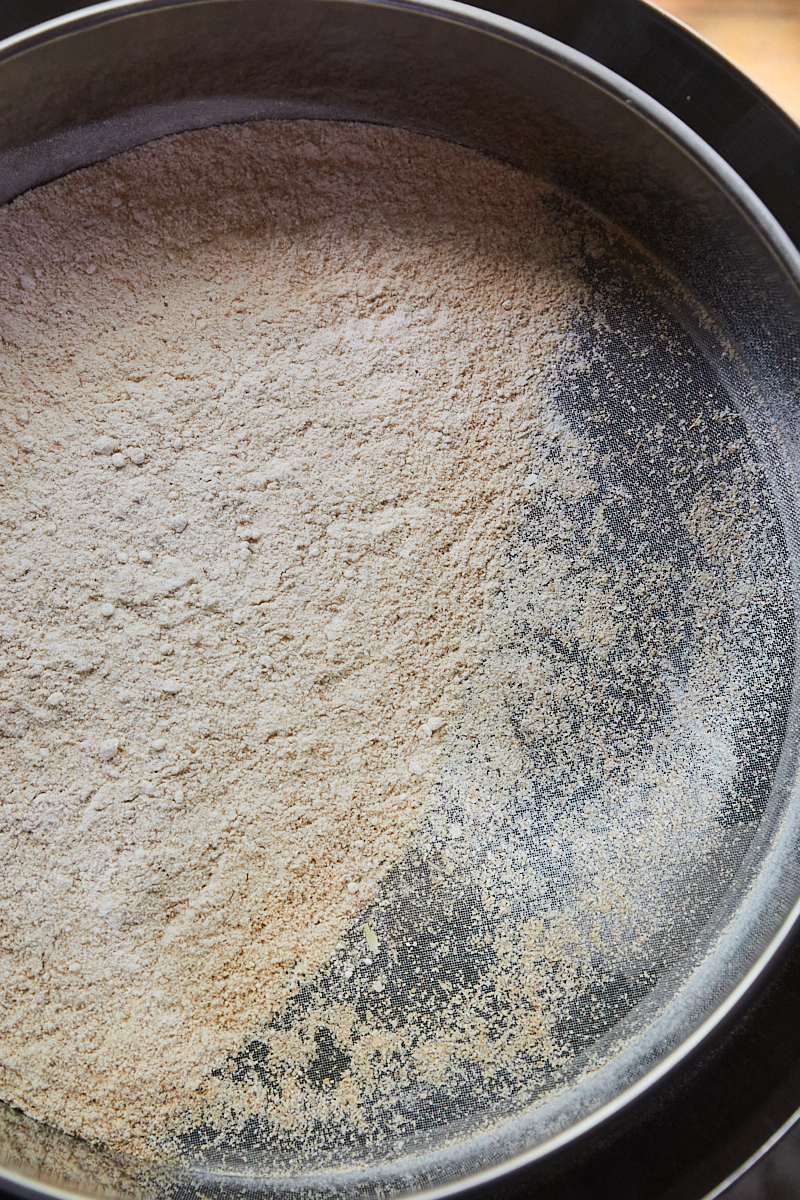 a close-up of flour being sifted