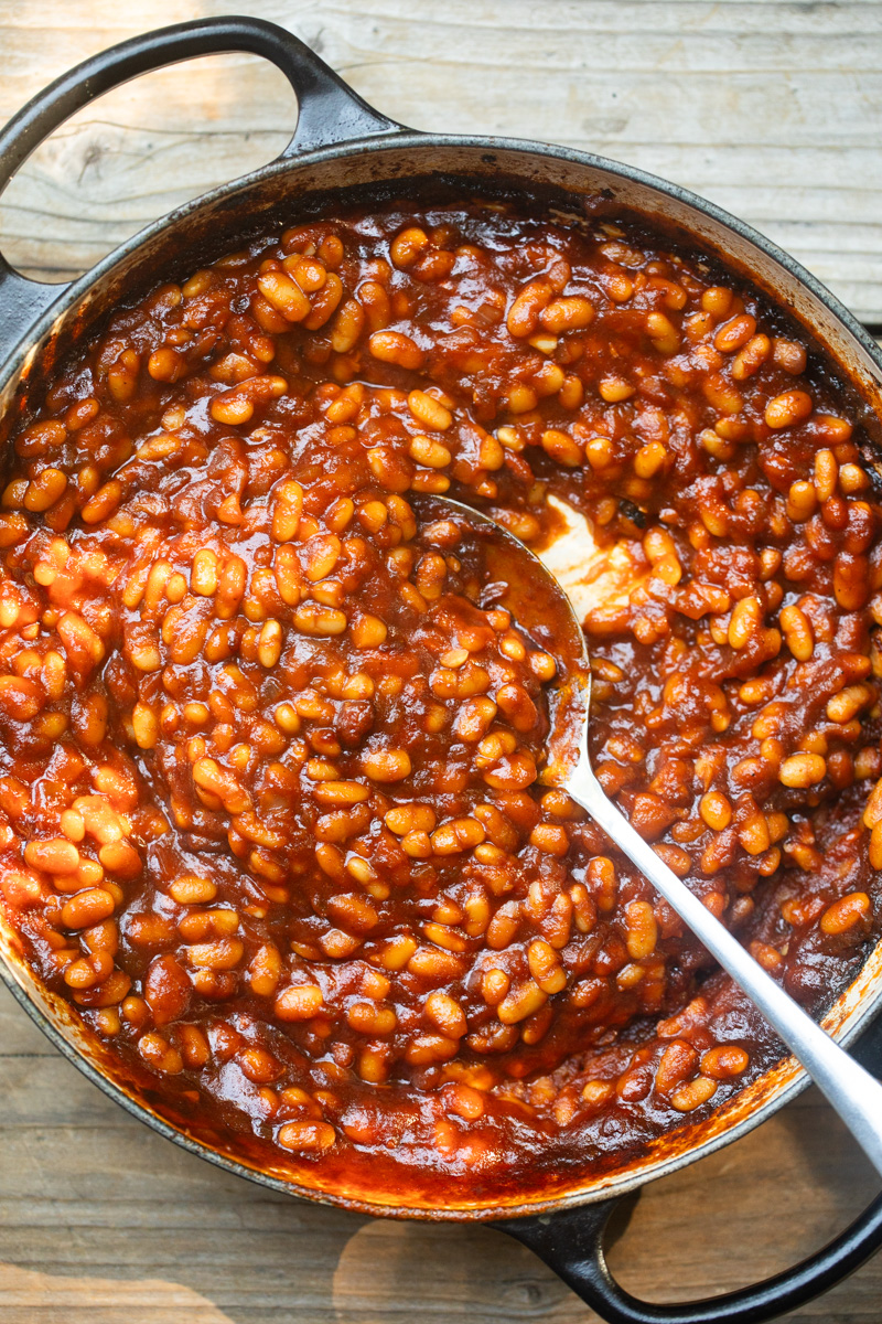 image of baked beans cooked in a low dutch oven. 