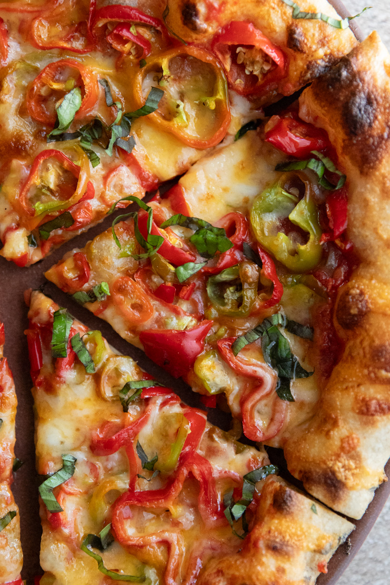 close-up of a chile and sweet pepper pizza slice