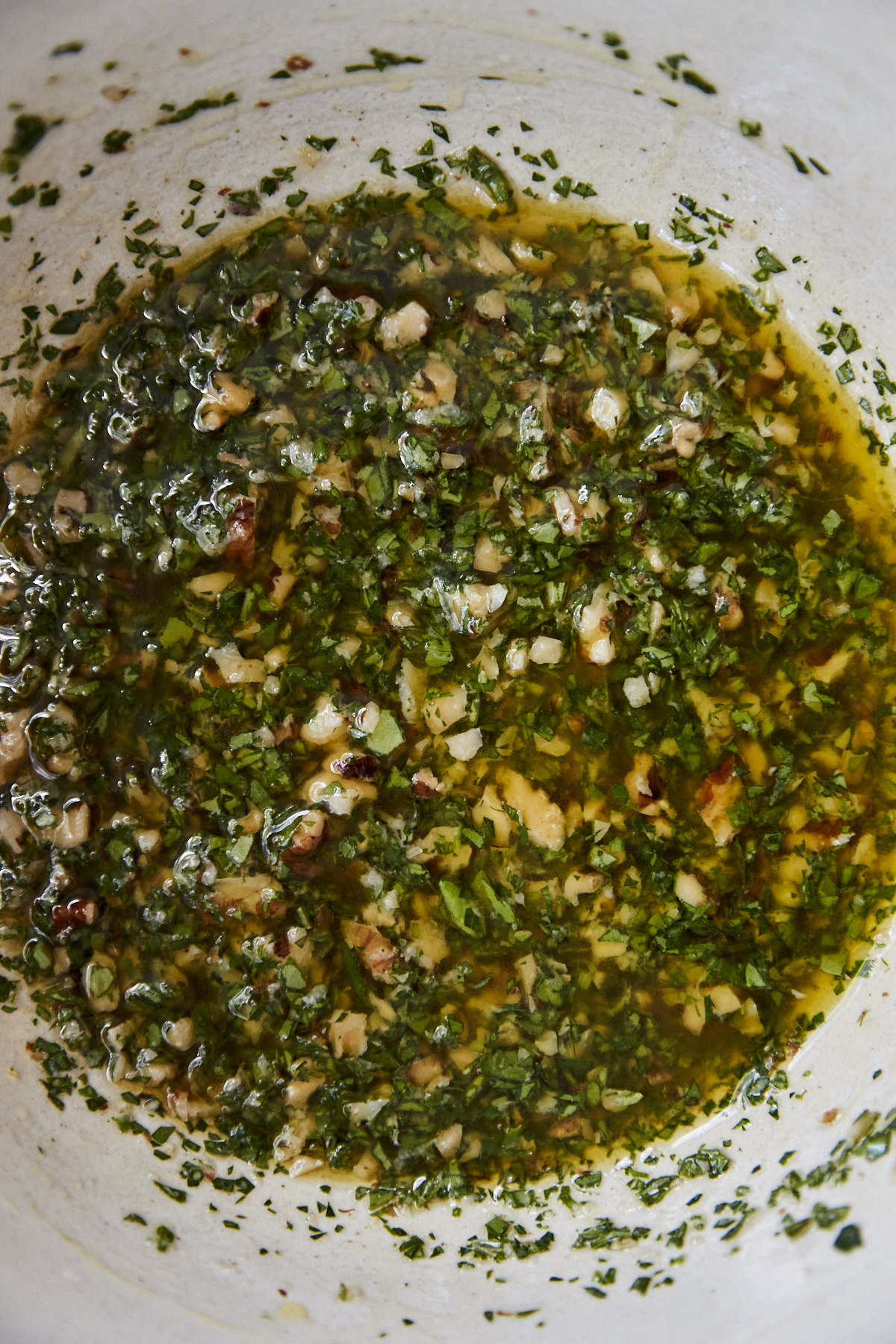 overhead image of an herby walnut dressing.